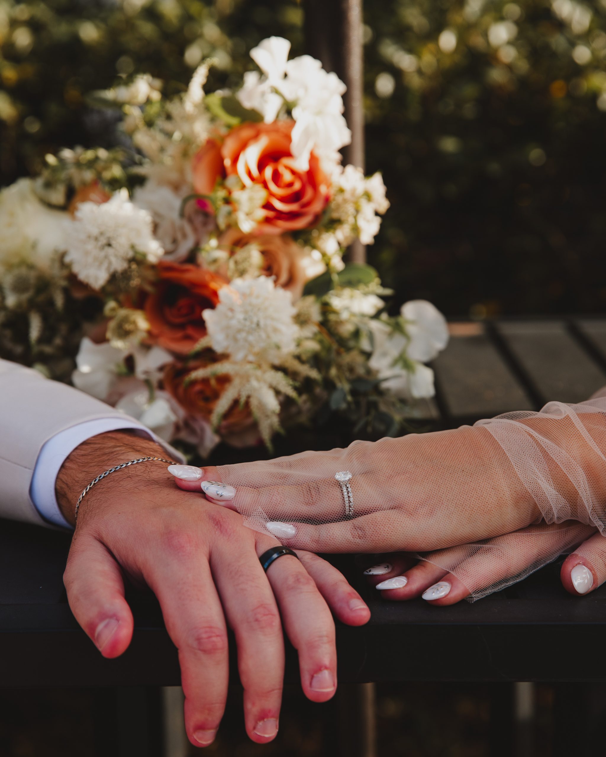 e04c9346-2623-4d8d-a0af-7f4310d59311 Charleston wedding photographer captures wedding ring details of the bride and groom at their I'On wedding.